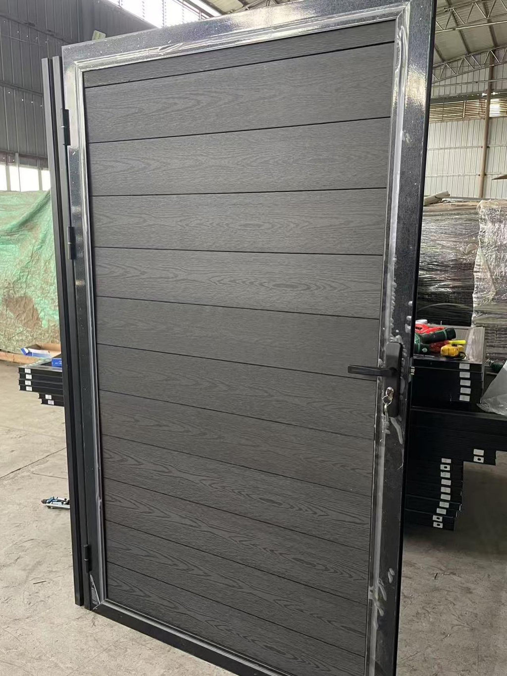 Modern Aluminum Privacy Gate with Composite Wood Panels by the steel fabrication shop, product image 1