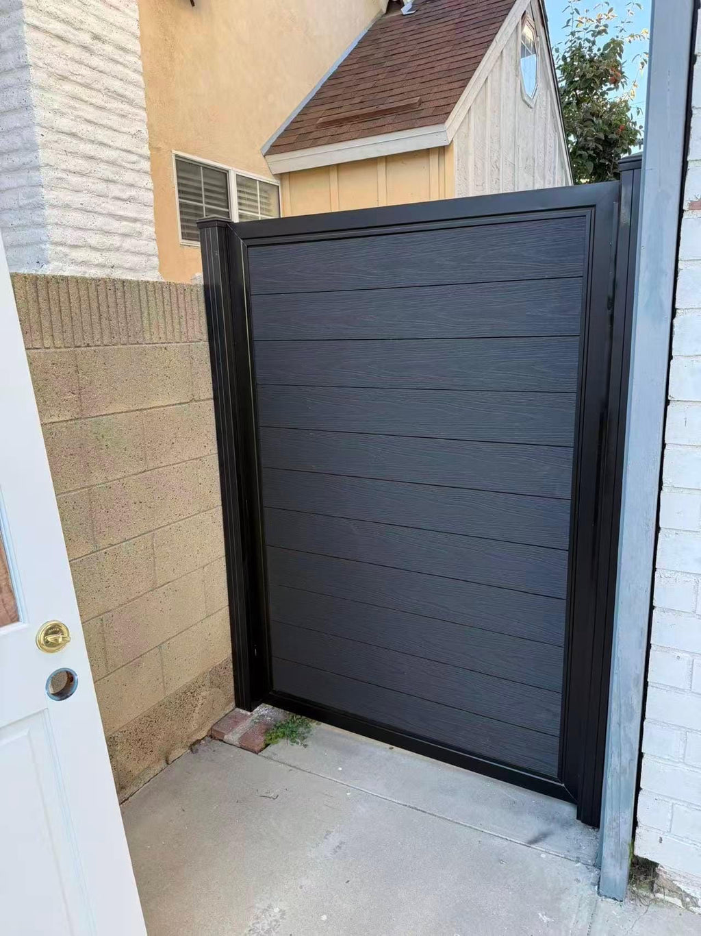 Modern Aluminum Privacy Gate with Composite Wood Panels by the steel fabrication shop, product image 3