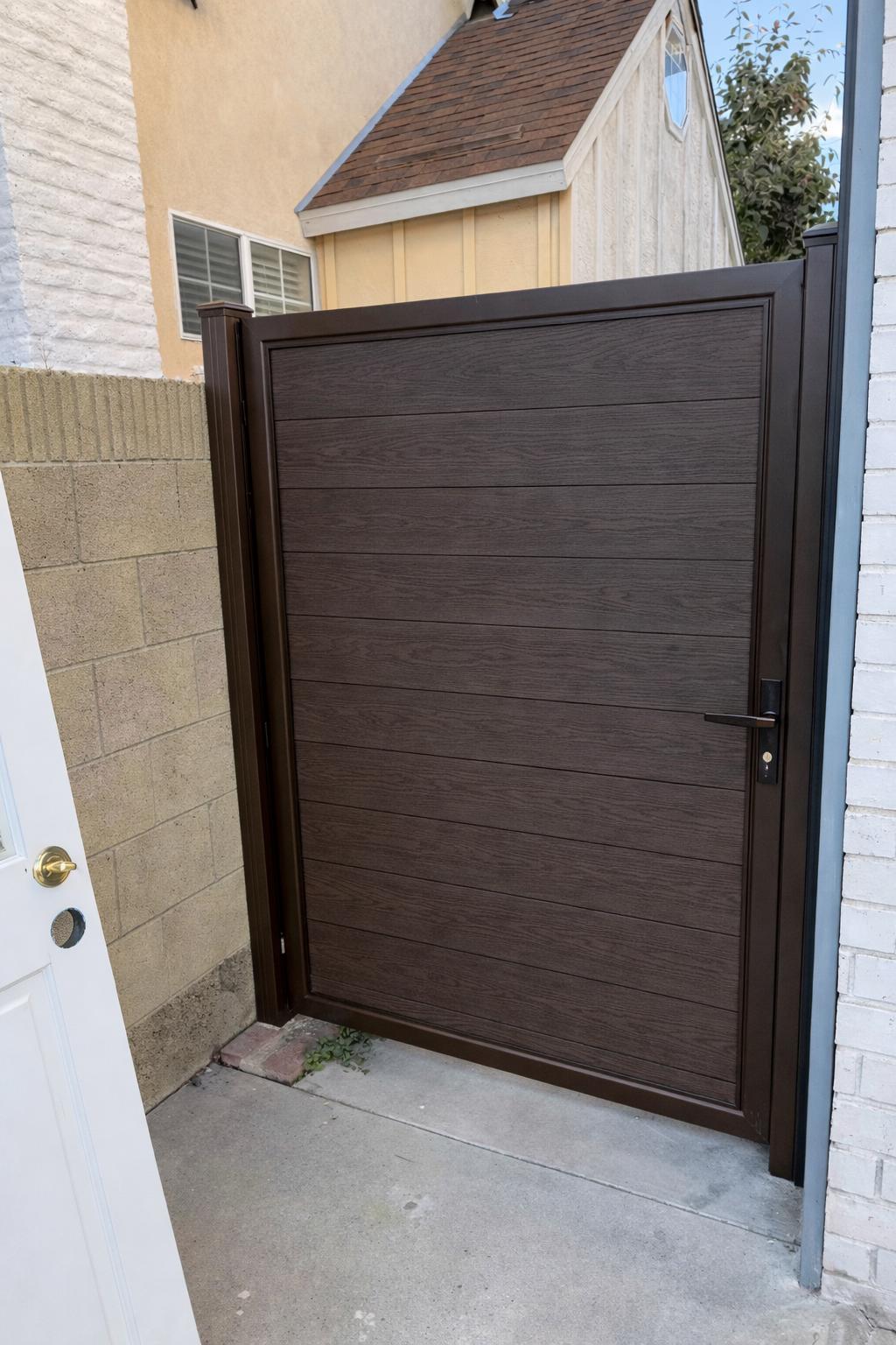 Modern Aluminum Privacy Gate with Composite Wood Panels by the steel fabrication shop, product image 4